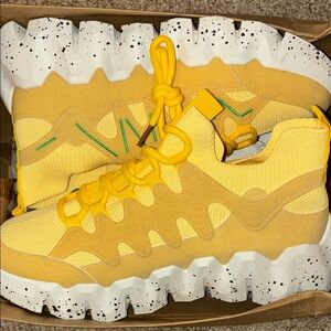 Yellow chunky fashionable shoe.